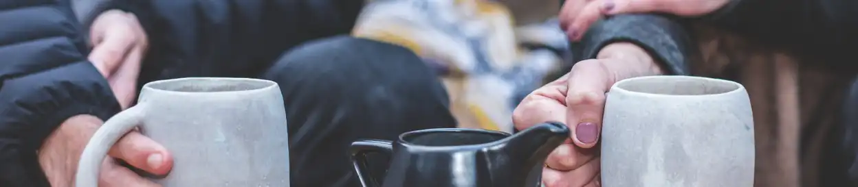 Friends sharing cups of tea